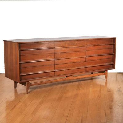 "YOUNG FURNITURE MID-CENTURY CURVED TRIPLE DRESSER | Triple dresser having nine drawers with concave curved from, fixed carved pulls...