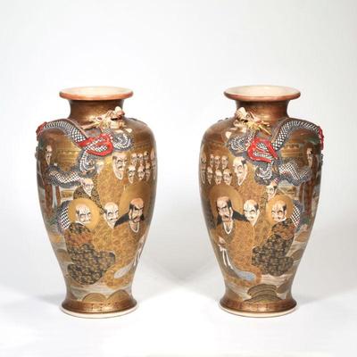 PAIR GILT SATSUMA BALUSTER VASES |  Richly decorated with gilt scenes of robed figures, mounted with opposing red painted sinuous...