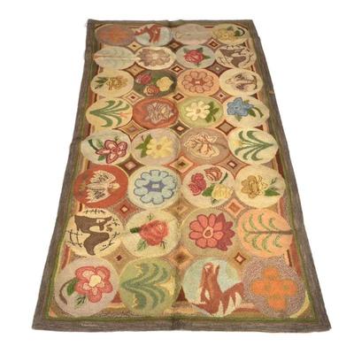 ANTIQUE AMERICAN HOOKED RUG, HILFIGER COLLECTION | Decorated with figures within circular reserves - w. 66 x l. 127 in.