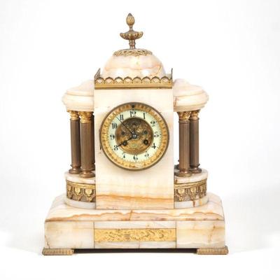 "ALABASTER SHELF CLOCK | Intricate and heavy white onyx or alabaster case and frame, with two sets of three brass columns centering...