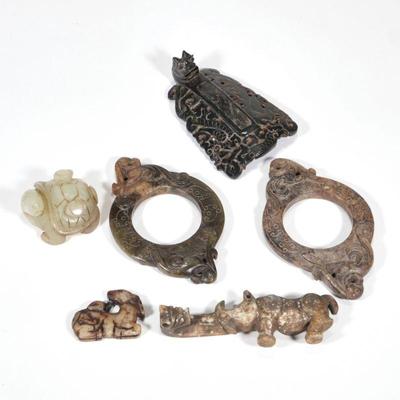 "(6pc) CHINESE STONE CARVINGS | Including a jade carved turtle (w. 2.25 in.), two hardstone rings, a carved stone rhinoceros-form...