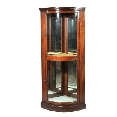 "CONVEX GLASS CORNER DISPLAY CABINET | Having two convex glass paneled doors, medial shelf, interior with mirrored back
h. 69.5 x w....