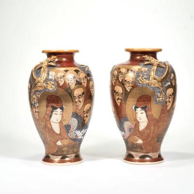 PAIR JAPANESE SATSUMA VASES | With opposing raised and gilt dragon, each signed on the underside
h. 12 x dia. 6.5 in.
