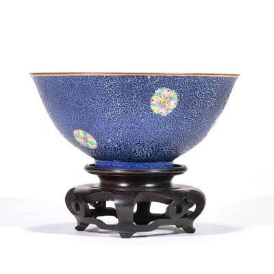 "CHINESE PORCELAIN BOWL | The sculpted exterior decorated with famille rose medallions on a cobalt ground, having a gilt rim, with...