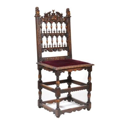 "19TH CENTURY CARVED OAK HALL CHAIR | Crested by carved lions holding shields, openwork backrest, decorated with griffin and a...