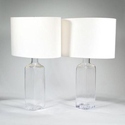 "PAIR SIMON PEARCE BLOWN GLASS LAMPS | Fitted with brass electrified tops mounting harps and oval shades, signed on base
h. 25.5 x...