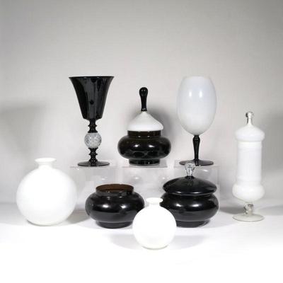 "(8pc) OTTO BRAUER BLACK & WHITE GLASS | Comprising: five open vases/ jars and three with lids
h. 15 x dia. 7 in. (tallest)"