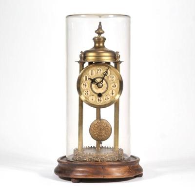 "GLASS DOME & BRASS CLOCK | Skeleton mantel clock on wood base with glass dome
h. 14.5 x dia. 8 in."