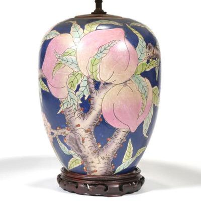"CHINESE GINGER JAR LAMP | Decorated with peaches and blossoming branches and bats over a blue ground
h. 11.5 x dia. 9 in. (jar...