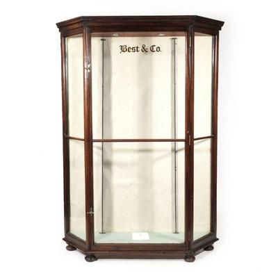 "BEST & CO. GLASS ANTIQUE DISPLAY CABINET | having a single glass door flanked by two glass panels
h. 77 x w. 56 x d. 16 in."