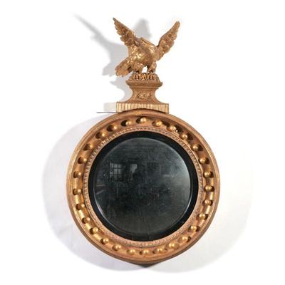 DIMINUTIVE EAGLE CONVEX MIRROR | Gilt carved eagle finial over gilt convex mirror.
