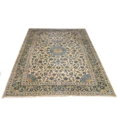 "SCULPTED CARPET | Cream field with a central pale blue medallion
h. 163 x w. 116 in."