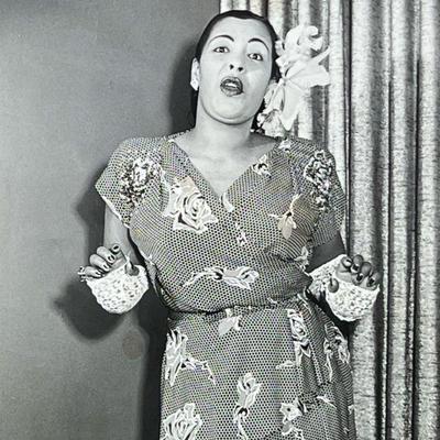 "BILLIE HOLIDAY SILVER GELATIN PHOTOGRAPH | Monochrome photographic print of Billie Holiday, matted and framed; sight 9.25 x 7.5...