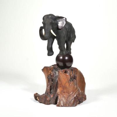 JAPANESE BRONZE ELEPHANT | Possibly Meiji period, on a wood base
h. 13 x w. 7 x l. 10 in.
