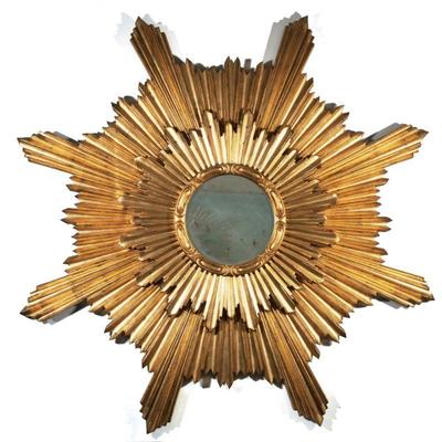 LARGE GILTWOOD DOUBLE SUNBURST MIRROR | 20th century, transitional art deco style, with two layers of finely gilt carved wood in sunburst...