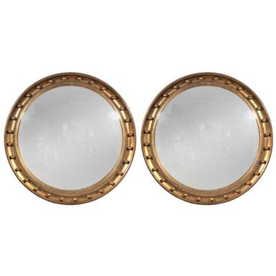 PAIR GILT BUILLOTE MIRRORS | Buillote mirror with gilt carved wood frame and formed beaded border - dia. 29.5 in.