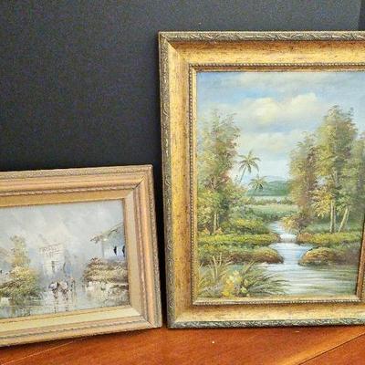2 Paintings of landscapes in muted gold or antique gold with some weathered or distressed detailing,