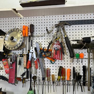 Tools And Contents Of Workshop Pegboard 