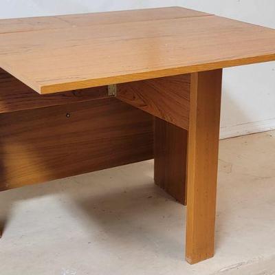 *PROJECT* MCM Style Fold Out Table 
https://ctbids.com/estate-sale/35441/item/3985162/PROJECT-MCM-Style-Fold-Out-Table