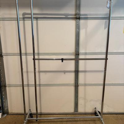 Two Rolling Hanging Clothing Racks