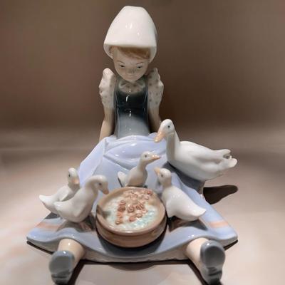 Lladro porcelain figurine titled “Feeding The Ducks”