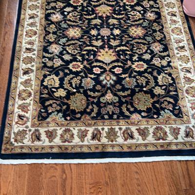 Small Dark Blue And Tan Area Rug