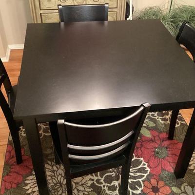 Black dinette table and 4 chairs