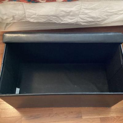 Black storage ottoman open