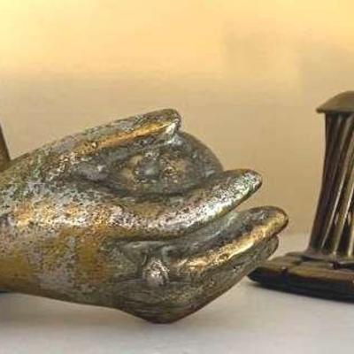 Brass hand door knocker