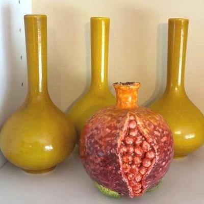 Ceramic pomegranate and trio of yellow bud vases
