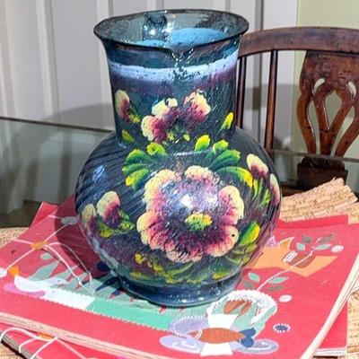 Blue glass pitcher with floral embellishments