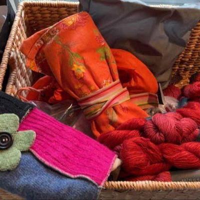 Basket full of knitting needles skeins of shibui staccato yarn & more