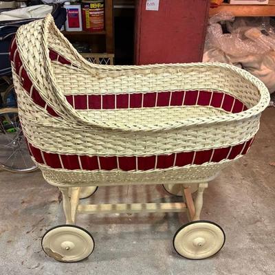 Antique wicker baby bassinet with wheels