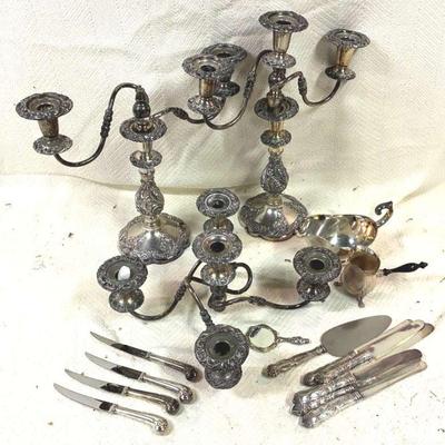 Silverplate candlesticks and flatware