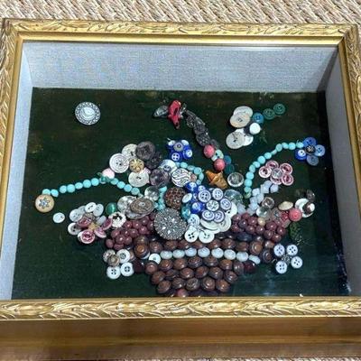 Button collage in shadow box