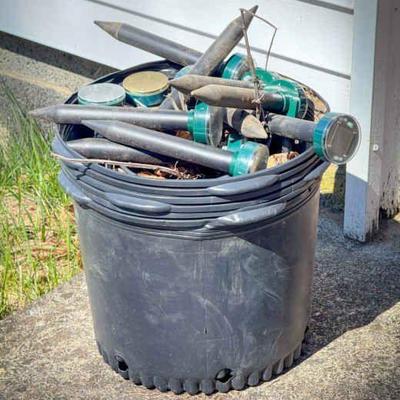 Planters Full of Lawn Light Stakes Mystery

