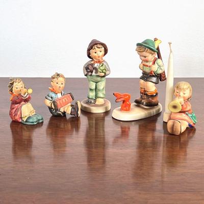 (5pc) Assorted Hummels | Hummel figurines, including three marked "W. Germany," four numbered, and one with candle holder. - h....