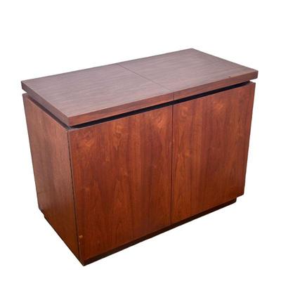 Arthur Umanoff for Dillingham Expanding Bar Cabinet | A mid-century modern teak wood bar cart / cabinet, with expanding top over double...