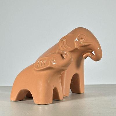 (2pc) Porcelain Elephants | By Jaru, with label to underside, salmon-colored glazed ceramic elephant figures. - h. 7.5 x w. 5.5 x l. 10.5...