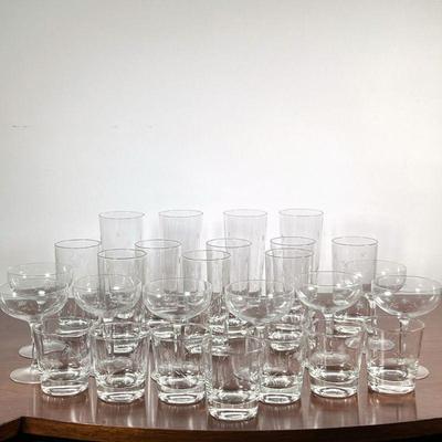 (27pc) Mixed Glasses With Star Etching | 8 champagne; 7 scotch; 8 highball; and 4 beer glasses, all with etched star motif. - h. 7 x dia....