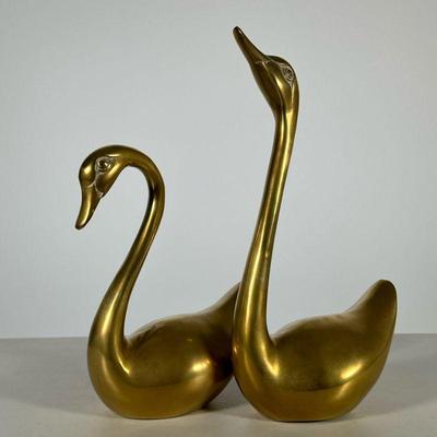 Pair Mid-century Brass Swans | A set of two mid-century modern brass swans. - h. 12 in (largest)

