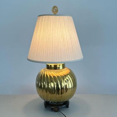 Hammered Brass Table Lamp | Swirled and hammered polished brass lamp mounted on a wooden stand. - h. 29.25 x dia. 16 in (with shade)

