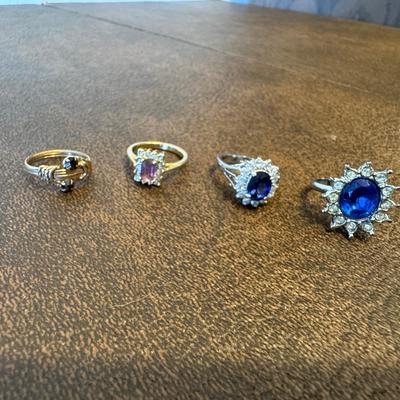 Gold And Silver Toned Rings With Nice Stones In Blue And Crystal