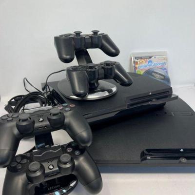 Two PlayStation 3 Consoles, Four Controllers & Chargers