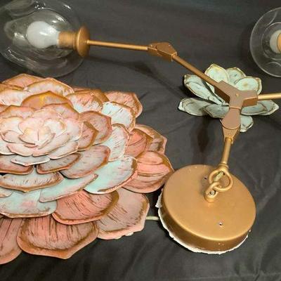 Metal wall flowers and three light ceiling fixture