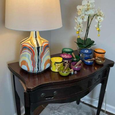 Accent table with lamp orchid arrangement, and singing bowls