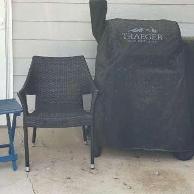 Traeger wood fired grill and patio chairs