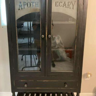 Vintage wooden cabinet with glass doors