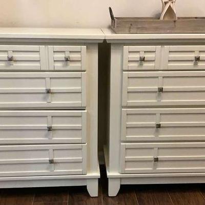 Set of two white dressers with multiple drawers