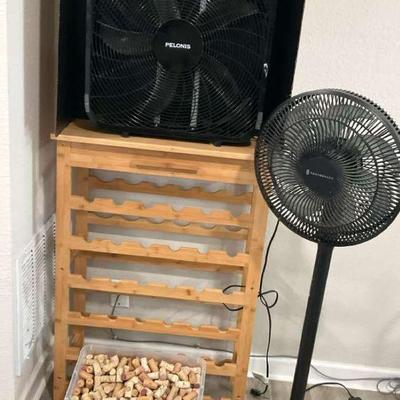 Two fans and wine storage rack